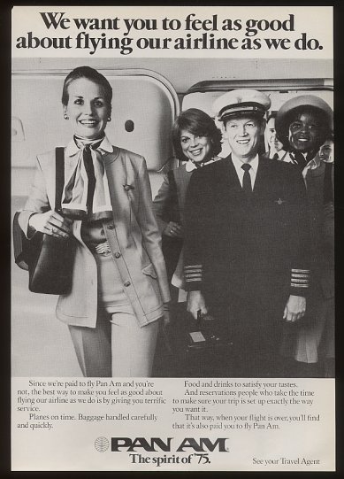 1975 A smiling Pan Am crew in the doorway of a 747.